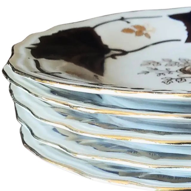 Elevate your tabletop with these collectible cobalt blue dessert plates from Germany, accented with delicate gold trim....
