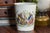 This English-made World War I porcelain beaker is a poignant and well-preserved piece of early 20th-century commemorative...