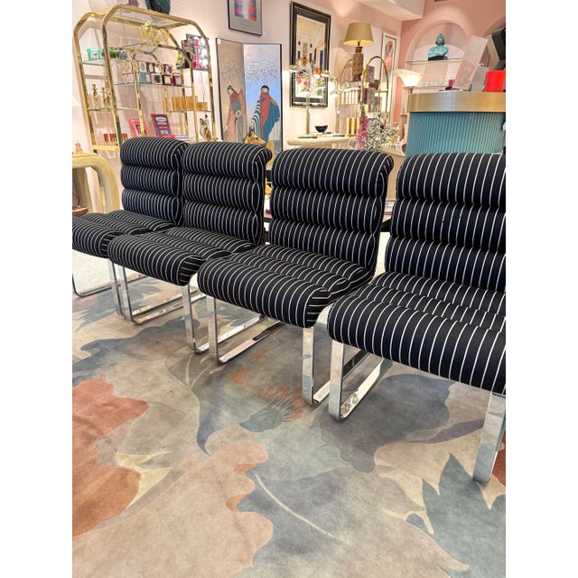 A spectacular set of 4 vintage Italian dining chairs designed by Frank Mariani for Pace Collection. With black and white...