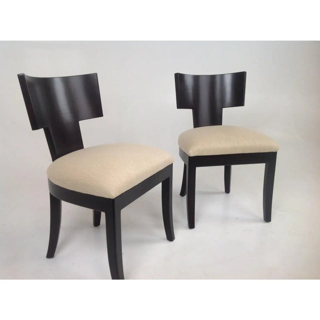 Pair of Modern chairs with soho finish. Chenille upholstery. Chairs have a dark chocolate /expresso finish. Frames are in...