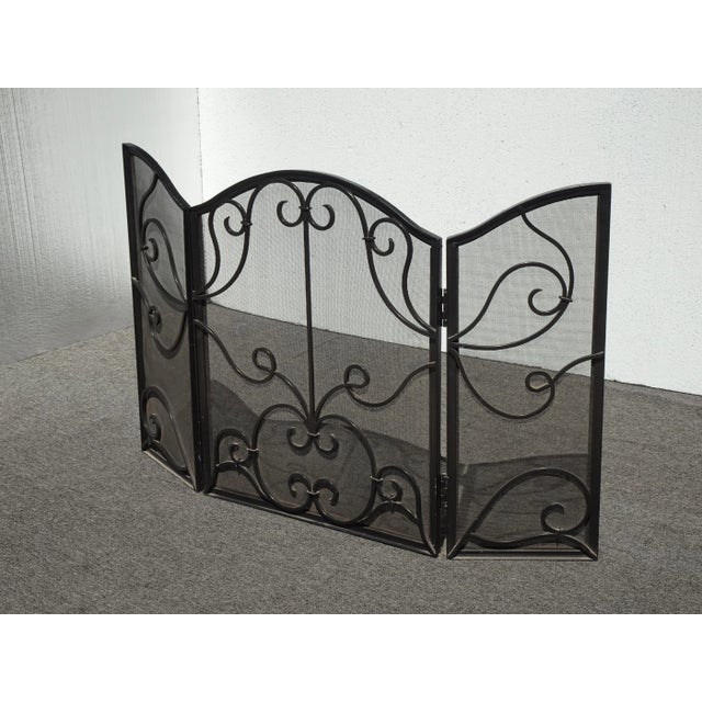 Vintage cast iron fireplace screen with a Chic Shabby style that is a charming and functional addition to any fireplace....