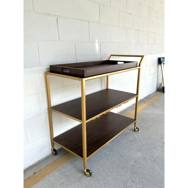 Stylish Hooker Furnishings Gold Bar Cart With Removable Tray. Brown wood with 4 racks to hang glasses. Showroom floor sample.