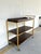 Stylish Hooker Furnishings Gold Bar Cart With Removable Tray. Brown wood with 4 racks to hang glasses. Showroom floor sample.