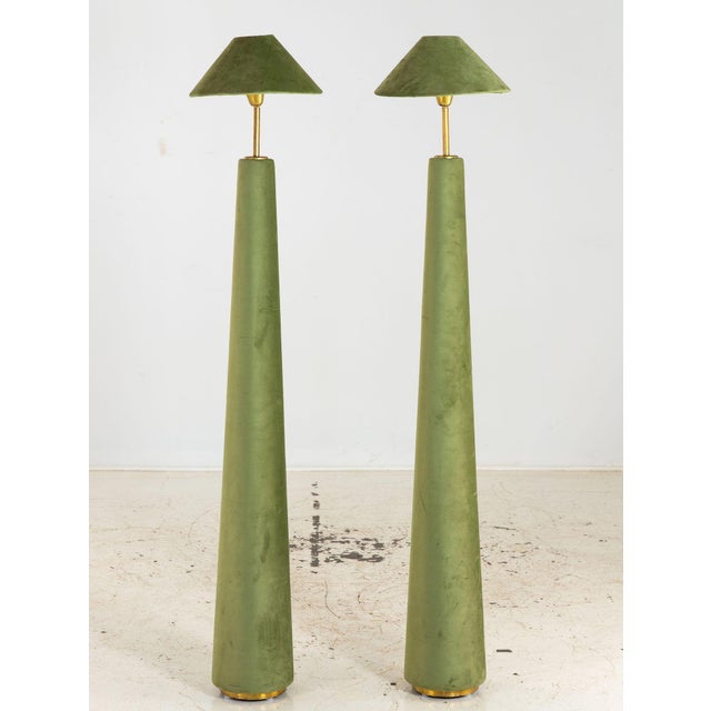 This pair of French floor lamps features tall vertical silhouettes wrapped in moss green velvet. The color brings depth...