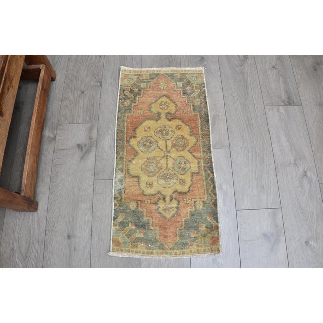 This is a vintage Turkish Oushak rug from the 1960s. The piece was hand-knotted.