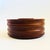 A large mid century wood chip and dip serving bowl. Features an attached smaller bowl on the inside for sauces surrounded...