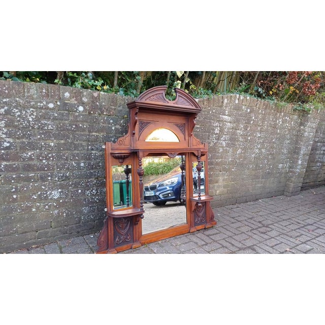 Make a bold statement in your home with this massive, imposing mahogany overmantel mirror that exudes a touch of class and...