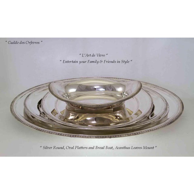 "A Set of 3 Three Silver Oval Platters 22, 24 & 30 in. with Acanthus Leaves Applied Border. Comprising : 1 - Silver Oval...