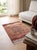 A hand-knotted Afghan Gabbeh rug in the Persian Gabbeh tradition, woven on a warm terracotta ground with a single tree of...
