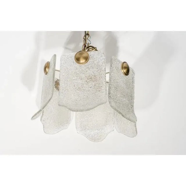 This stylish Mid-Century Modern chandelier is very much in the style of pieces created by Orrefors. Dimension not...