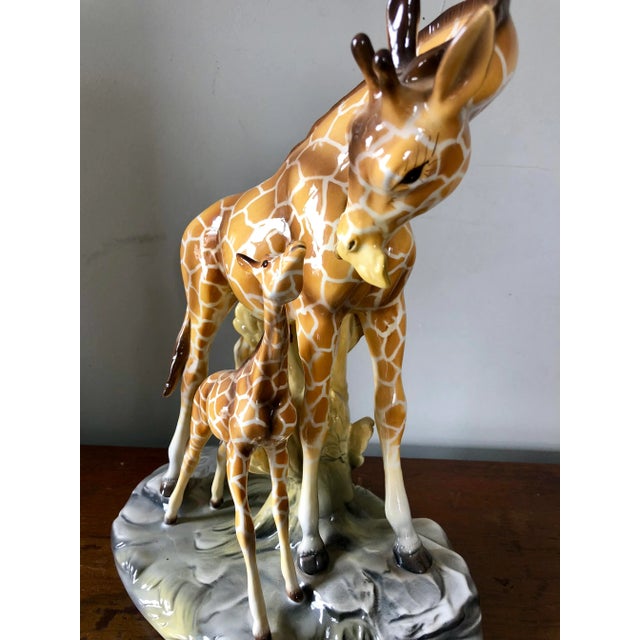 Vintage large ceramic mother and baby giraffe figure, marked "Made in Italy".