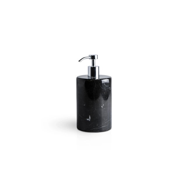 A rounded set for the bathroom in black Marquina marble which includes: One soap dispenser (diameter 9 x 19.5 cm), one...