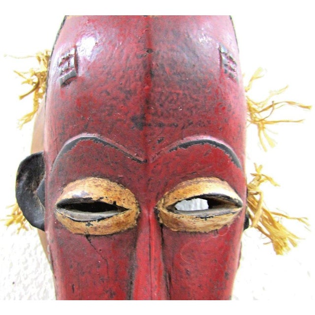 Red Antique Hand-Carved Guro Mask of the Ivory Coast Featuring a Seated Figure For Sale - Image 8 of 15