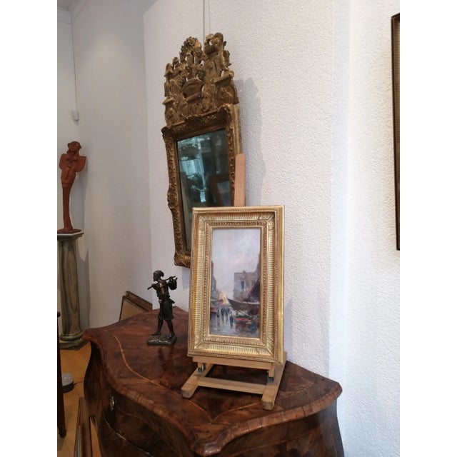 Italian painter born in 1864. Died in 1935 Early morning market This work depicts a bustling market under a misty sky,...