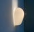Three classic "Shell" wall lights, designed by Wilhelm Wagenfeld in the 1950s. The Shell is a functional, elegant, and...