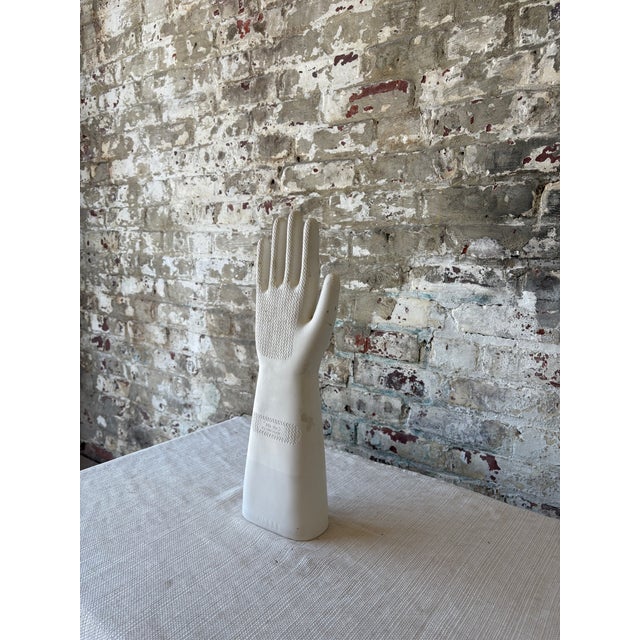 "A striking vintage ceramic glove mold, originally used in the manufacturing of rubber gloves, now repurposed as a...