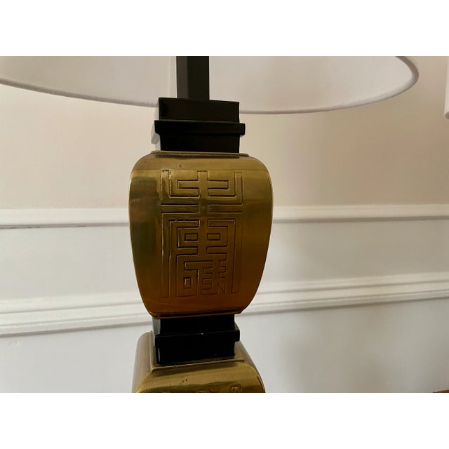 Pair of working James Mont lacquered and brass lamps in a unique Chinoiserie design. New linen lamp shades.