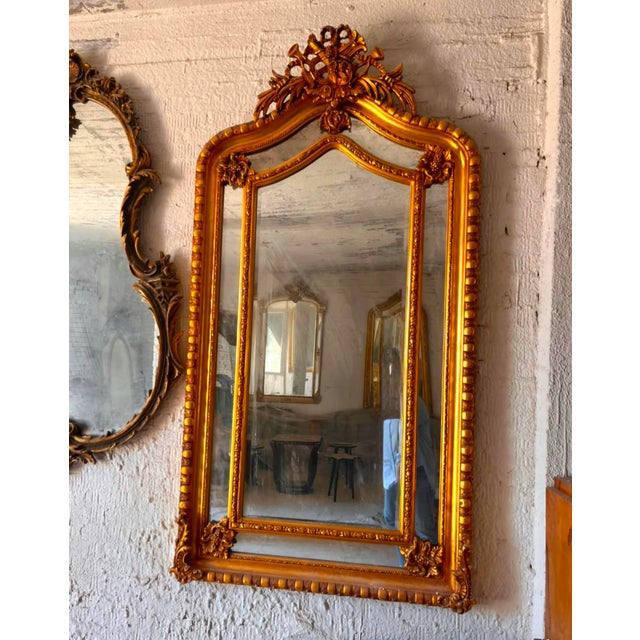 Make a statement with this magnificent French Rococo-inspired mirror, featuring an elaborate frame richly finished with...