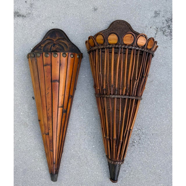 Striking vintage pair of sculptural rattan and bamboo wall pockets with a strong, architectural presence. The two pieces...