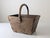 Rustic wooden container constructed from solid wood planks and reinforced with staples and hand-forged iron fittings. The...