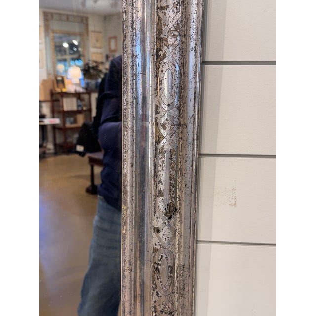 This magnificent French 19th Century silver Louis Phillipe mirror features an elaborate hand carved design. Mirrors of...