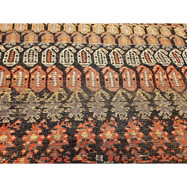 This vintage hand-knotted Persian Malayer rug features a captivating allover paisley pattern, a classic symbol of Persian...