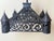 An antique gothic revival wrought iron chandelier with a highly architectural castle-like form, four turret sections,...