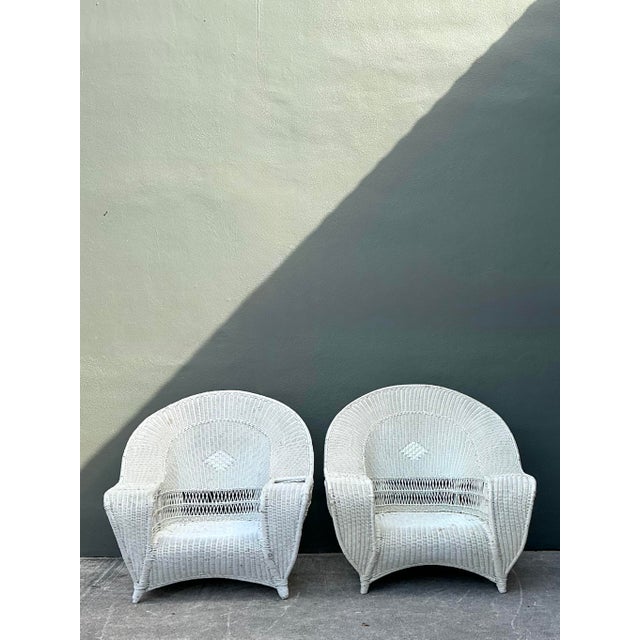 Capturing the breezy elegance of a coastal retreat, this pair of vintage Bar Harbor style lounge chairs offers a timeless...