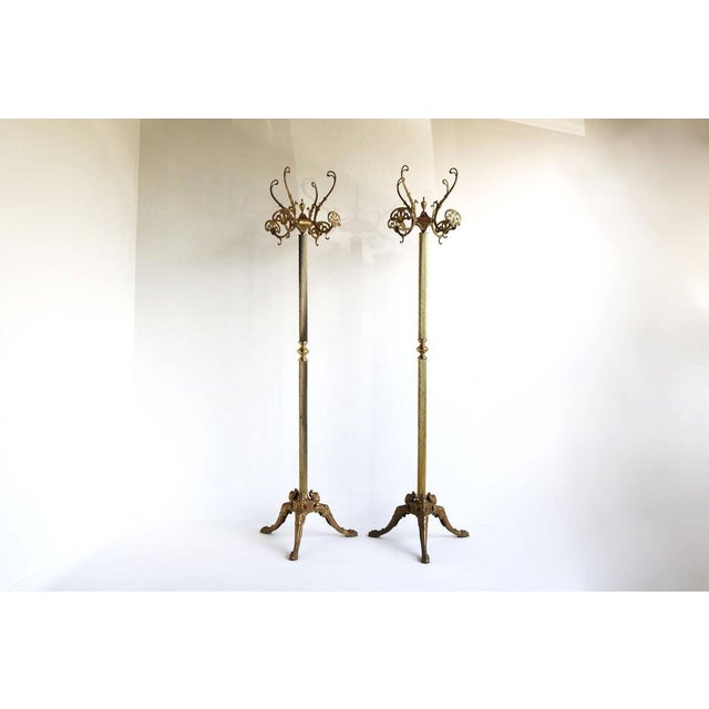 The purchase includes both coat racks shown in the photos. These beautiful solid brass hall trees date from the 1960s....