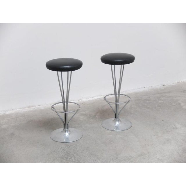 A lovely pair of modernist bar stools designed by Piet Hein during the 1960s. They feature a beautiful chromed steel frame...
