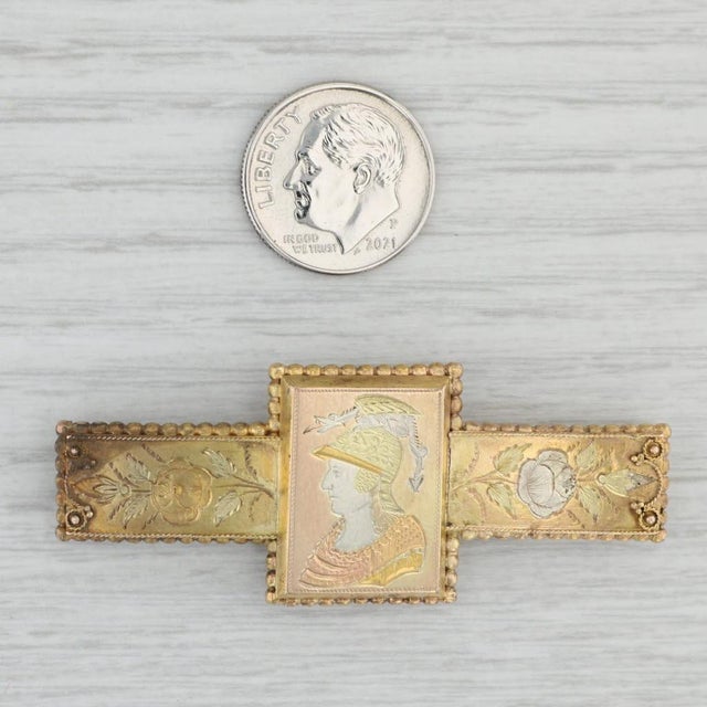 This great antique brooch dates from circa 1860 - 1870s and features finely detailed engraved floral and figural designs....
