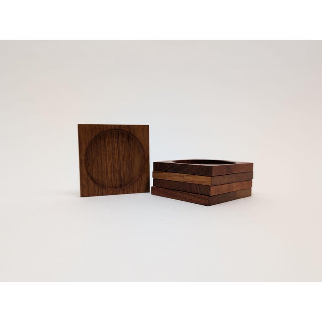 A nice set of 5 teak coasters . These will bring some style and protection to any table.