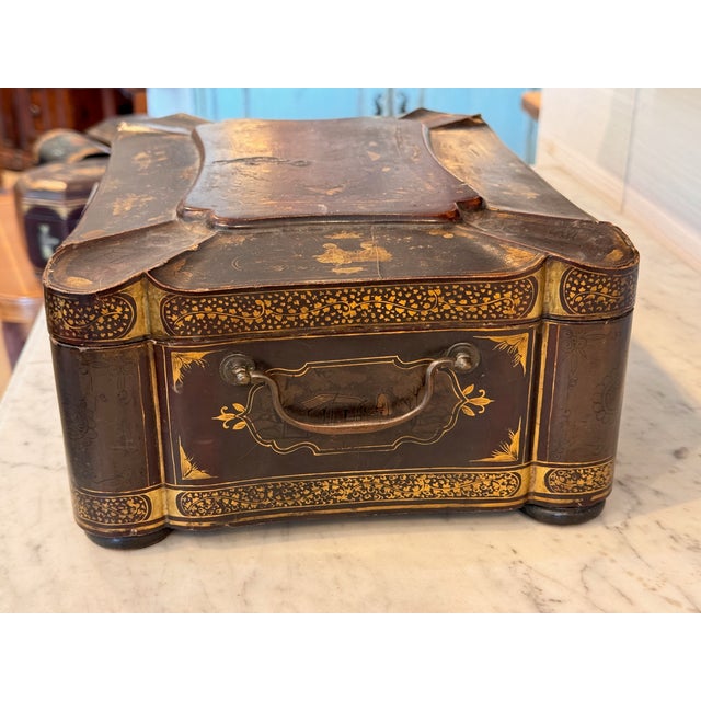 A nice Papier mache box. There are lots of compartments and drawers.