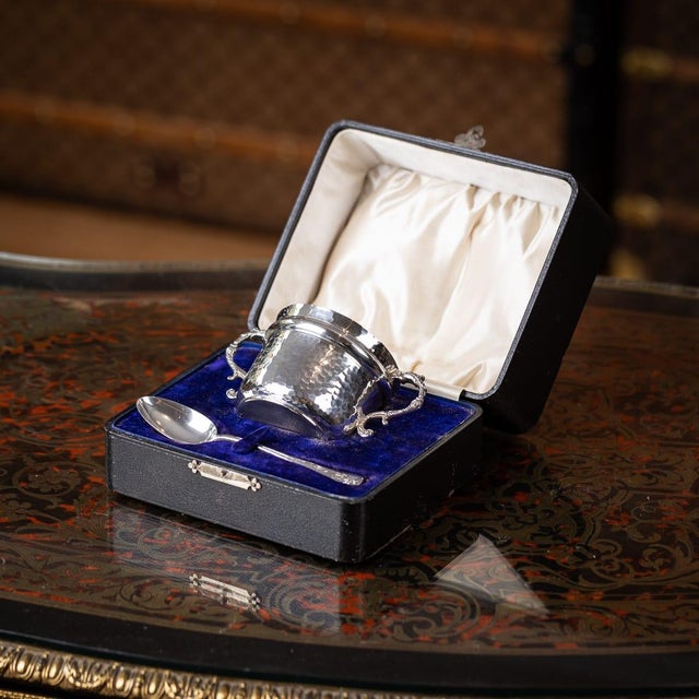 Antique 20th century english solid silver sugar bowl and spoon. The sugar bowl is hand hammered with a scrolling set of...