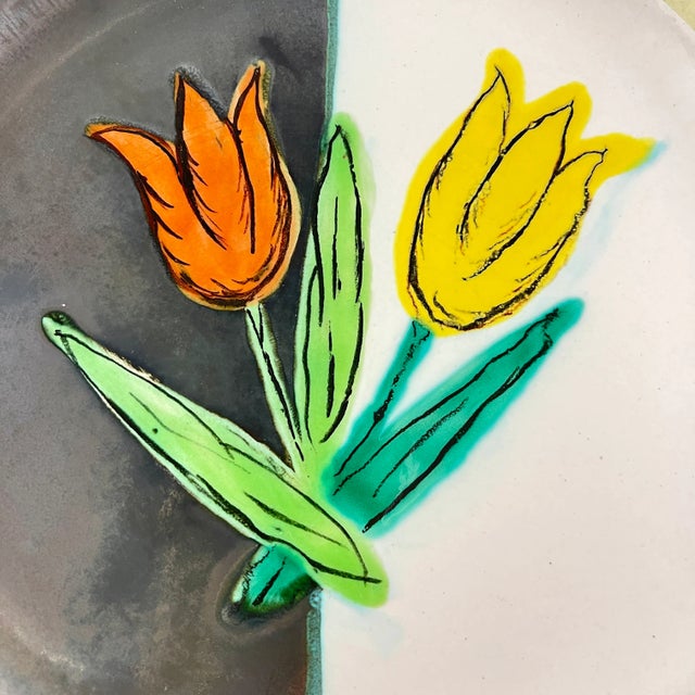 From the Atelier Cérenne à Vallauris in France, a hand made pottery Tulip plate, circa 1940-1950. The plate is finished in...
