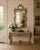 An exceptional late 20th century French Louis XV silvered giltwood mirror with richly carved Rococo detailing and a...