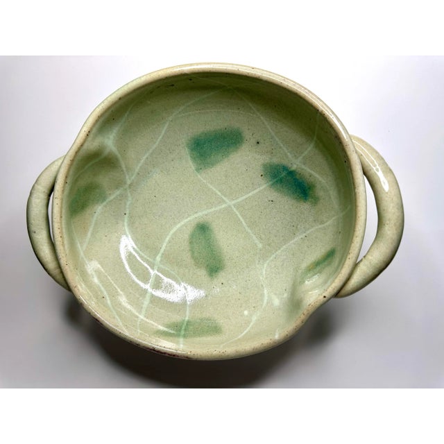 Unique shape and colors for this vintage studio art pottery style decorative bowl. The piece is ceramic with an abstract...