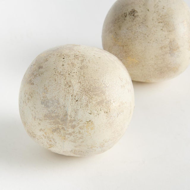 Hand painted, and handappliedGold leafing makes these decorative orbs special. Made out of iron, these substantial orbs...