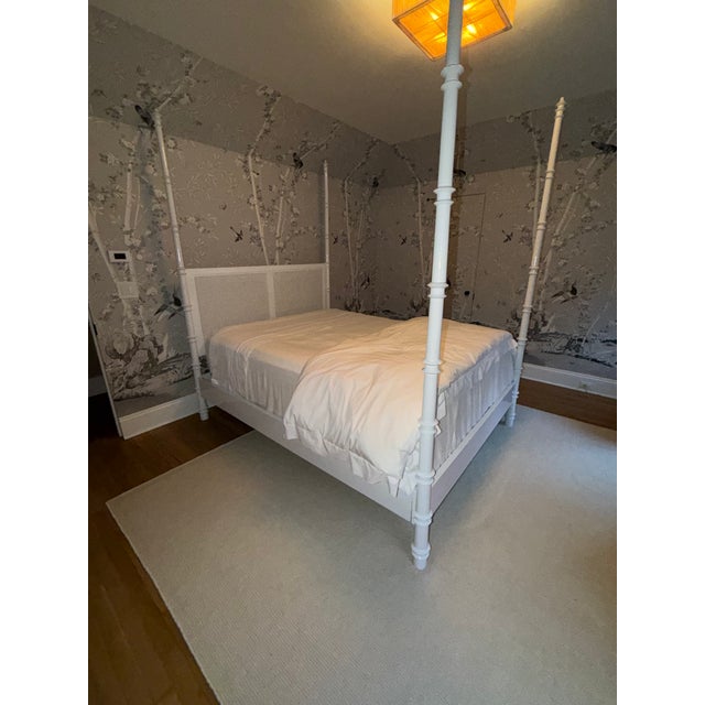 Queen size canopy bed attributed to OLY Studio featuring refined bamboo-style turnings, crisp white lacquer finish, and...