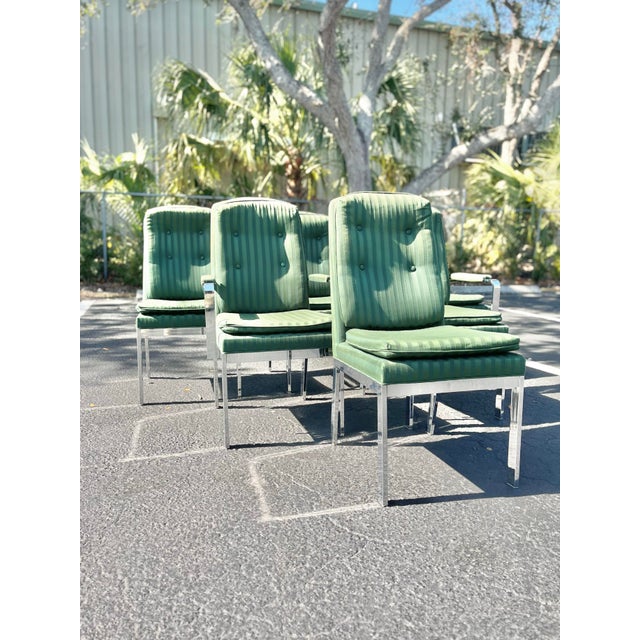 Set of six Mid century modern dining chairs. Chrome with a striped and tufted upholstery in the style of Milo Baughman....