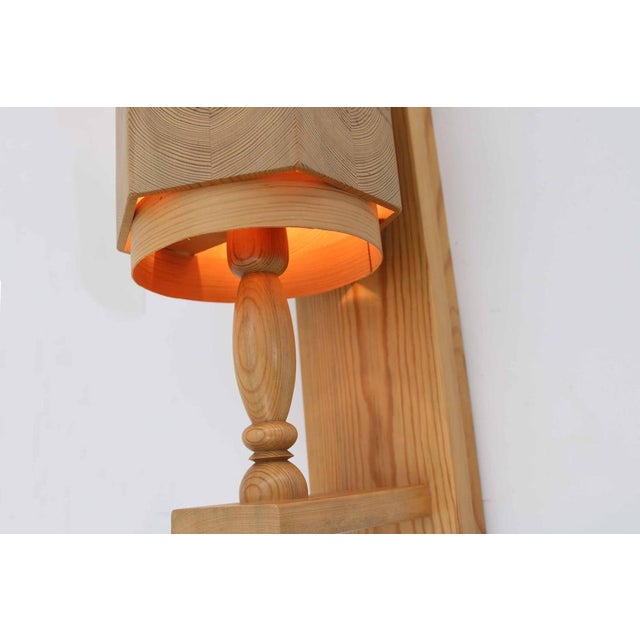 Leif Wikner Set of 2 wall lights Made in Sweden, 1970s Elegantly designed lights made of pine wood Height 45cm Width...