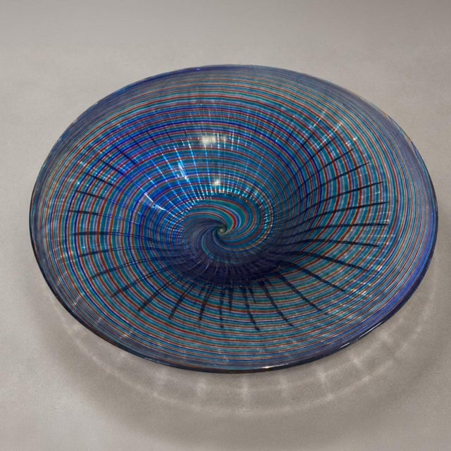 Stunning handblown art glass bowl by Stefano Toso, the famous Murano glassmaker. It features a spiral design with colorful...