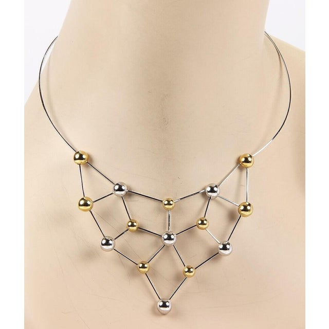 The Chimento 18k Two Tone Fine Polished Choker Bead Necklace is a luxurious and stylish piece of jewelry that exudes...