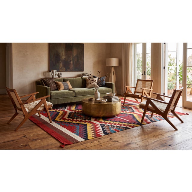 Elevate your space with this striking Southwestern flat-weave wool rug, featuring a bold, vibrant Eye Dazzler dynamic...