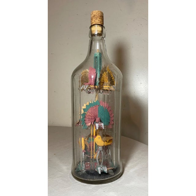 Up for sale is a rare antique handmade whimsical Folk Art sculpture/assemblage inside bottle. It's made of many different...
