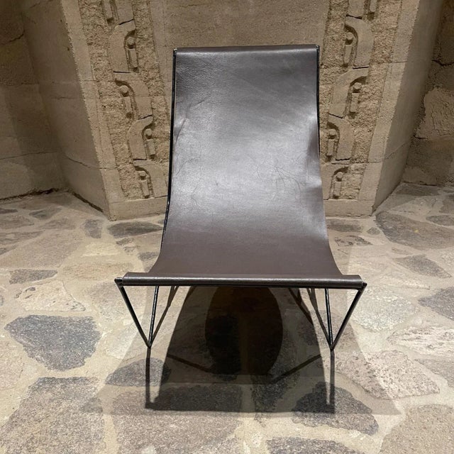 For your consideration, a ,modern studio recliner lounge low chair brown leather sling on a black painted Iron Frame. No...