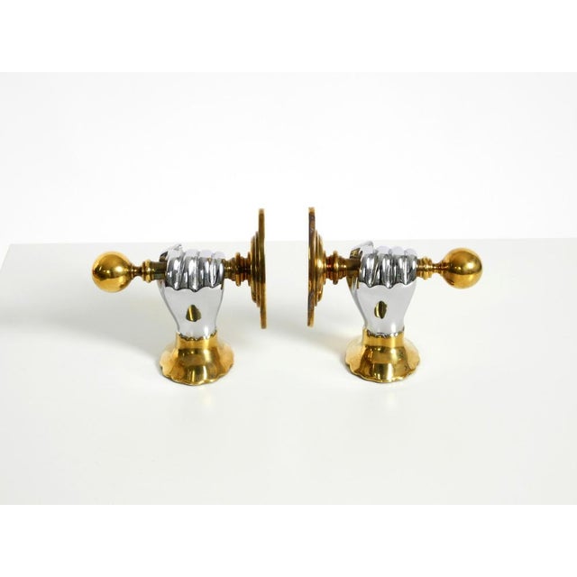 A pair of heavy, beautiful, decorative 1980s bookends made of brass and chrome by Vereinigte Werkstätten. High-quality,...