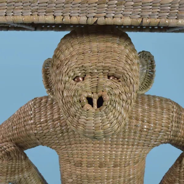 Woven Rattan Monkey Console Table by artist Mario Lopez Torres in nice as found condition. There is minor wear to the...
