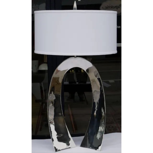 This lamp is made from welded stainless steel sheet and was made by Curtis Norton and is signed on bottom. .Lamp shade is...