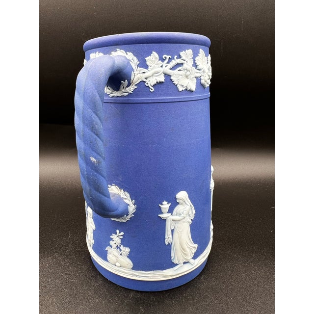 This Antique Wedgwood Jasperware Dark Blue Jug Pitcher from 1891-1908 is a charming piece of collectible dinnerware....